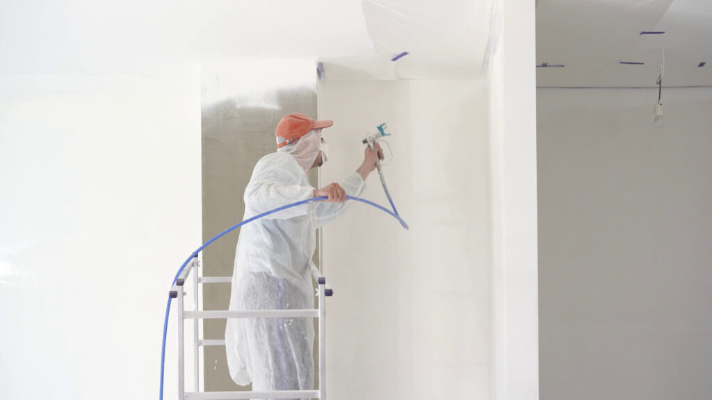 repair-of-the-apartment-professional-painter-paints-the-walls