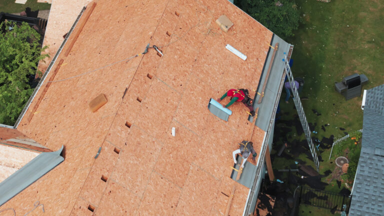 roofers installing a new-roof on a residential-building