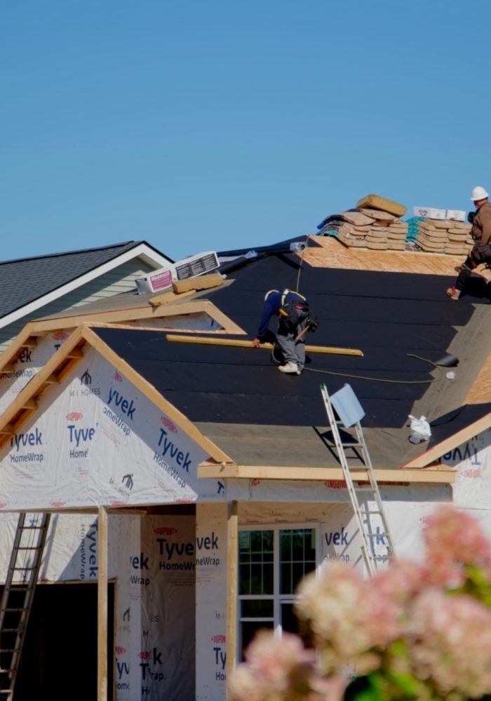 roofers-installing-a-new-roof-on-an-building-chicago-il-usa-12-sep-2023-SBI-349528244